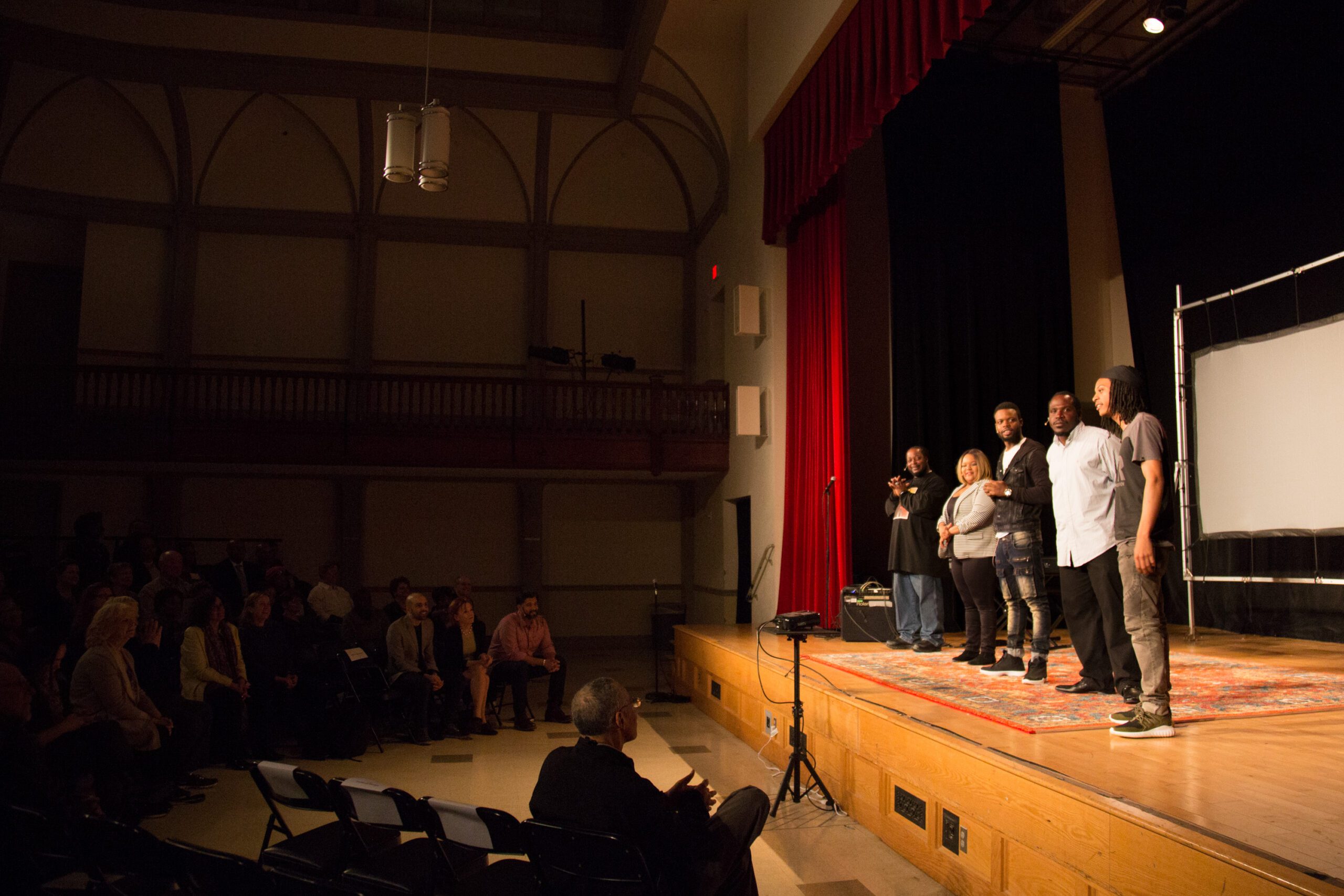 Life Stories performers on stage and lights